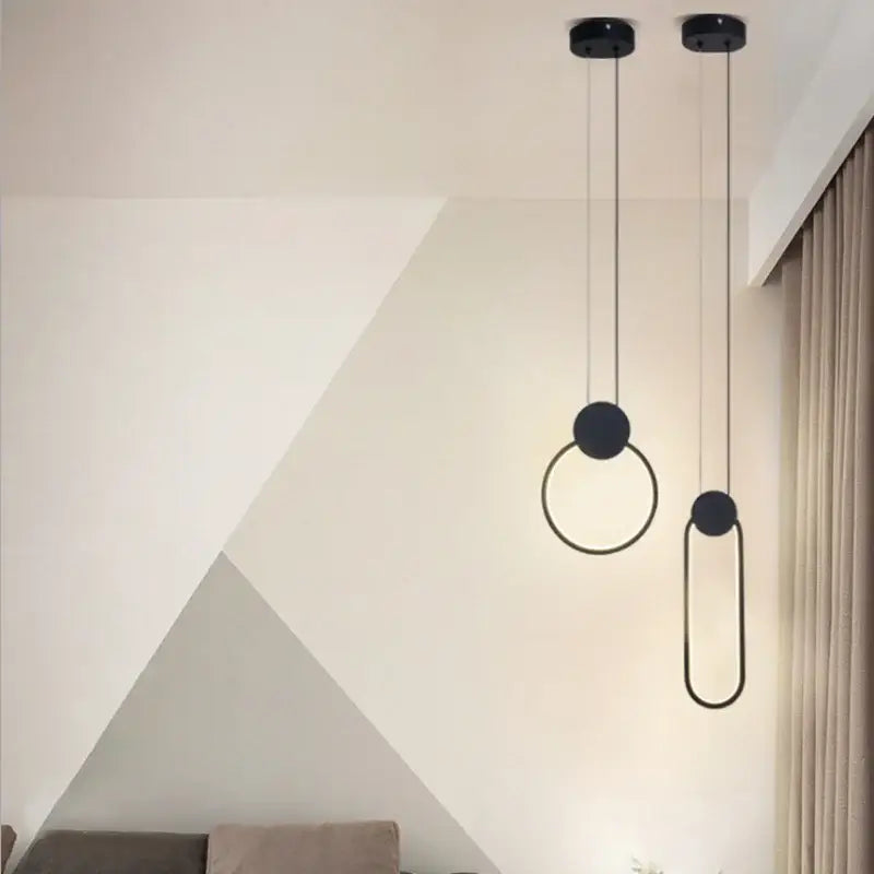 Modern black and gold crystal led pendant lights set of 3 featuring minimalist circular and oval ring designs by decorbites