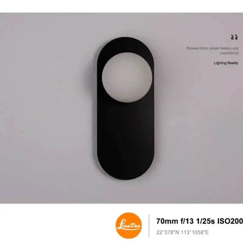 Minimalist black wall sconce with matte finish and oval frosted glass diffuser for decorbites glass ball led lighting