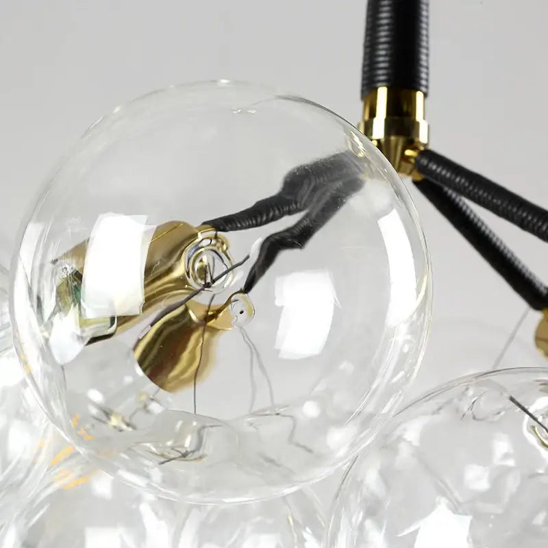 Clear glass globe pendant light with brass base and black wiring for minimalist decorbites glass balls ceiling use