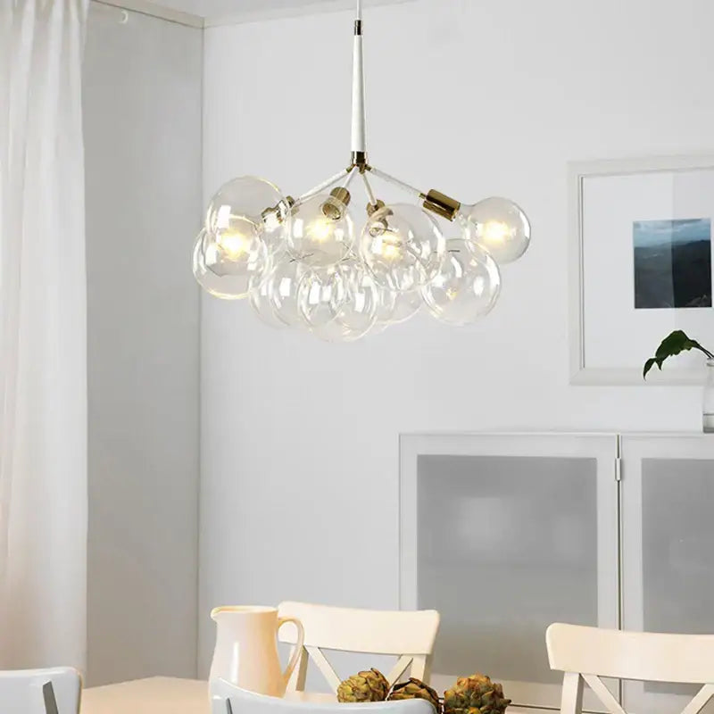 Minimalist black and gold glass balls ceiling pendant lights featuring a modern glass globe chandelier with brass accents