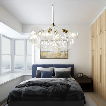 Modern black and gold pendant lights with brass accents featuring decorbites glass balls ceiling fixture above bed