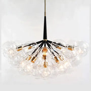 Clear glass globe pendant lights with a black stem and gold fixtures for minimalist decorbites glass balls ceiling use
