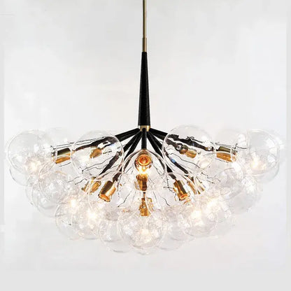 Clear glass globe pendant lights with a black stem and gold fixtures for minimalist decorbites glass balls ceiling use
