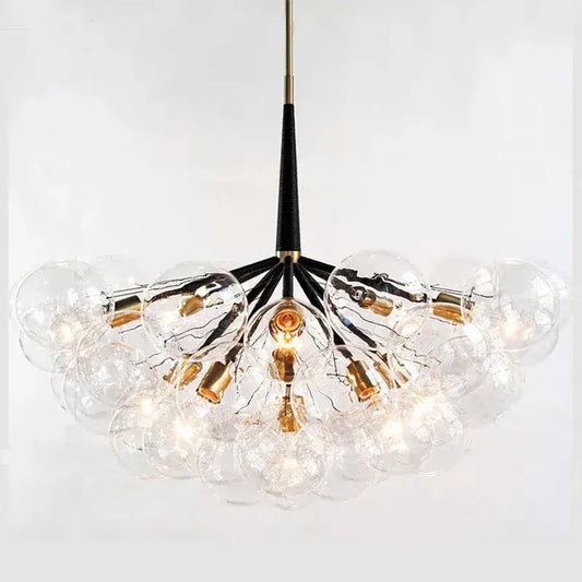 Clear glass globe pendant lights with a black stem and gold fixtures for minimalist decorbites glass balls ceiling use