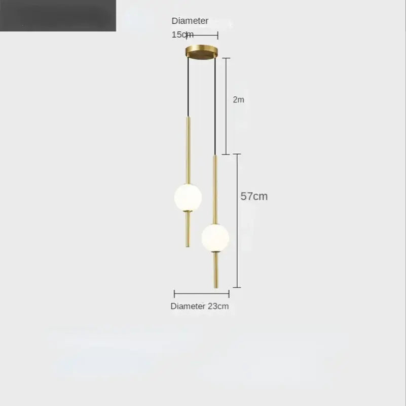 Minimalist black and gold globe pendant light with brass finish and frosted glass shades for cord pendant installation