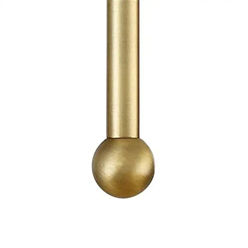 Minimalist black and gold led wall lamp featuring a sleek solid brass rod with a polished finish and smooth spherical ball end