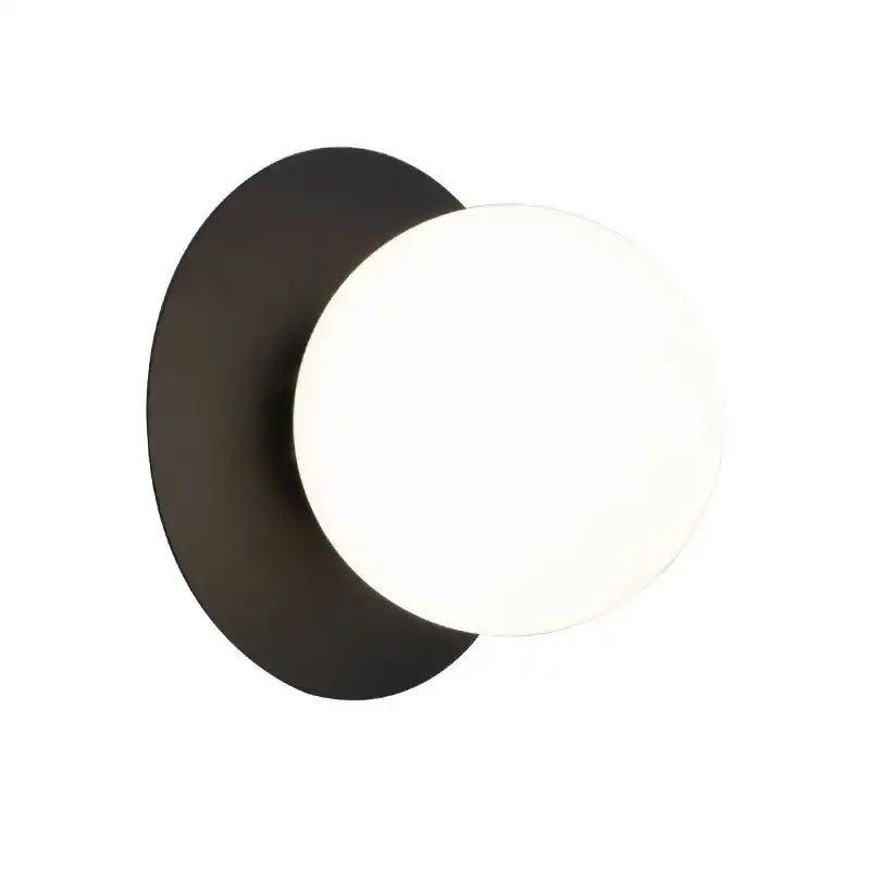 Minimalist black and gold led wall lamp with matte circular base and white glass diffuser for living room use