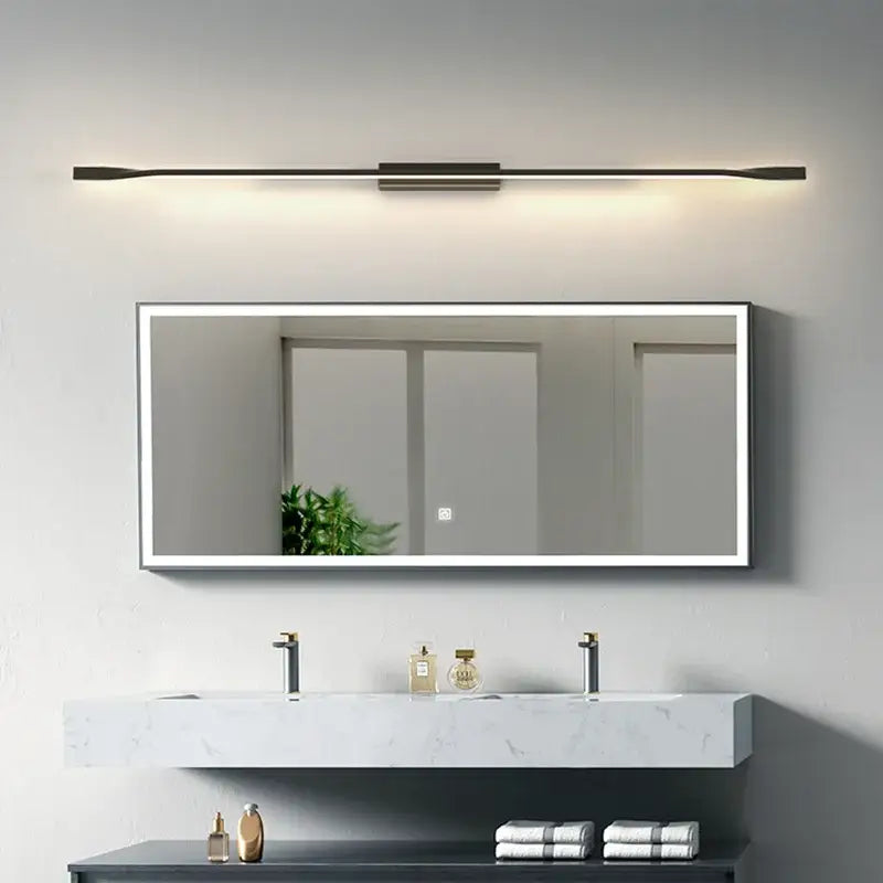 Modern rectangular mirror with slim white frame and integrated led lighting complementing decorbites led wall sconce