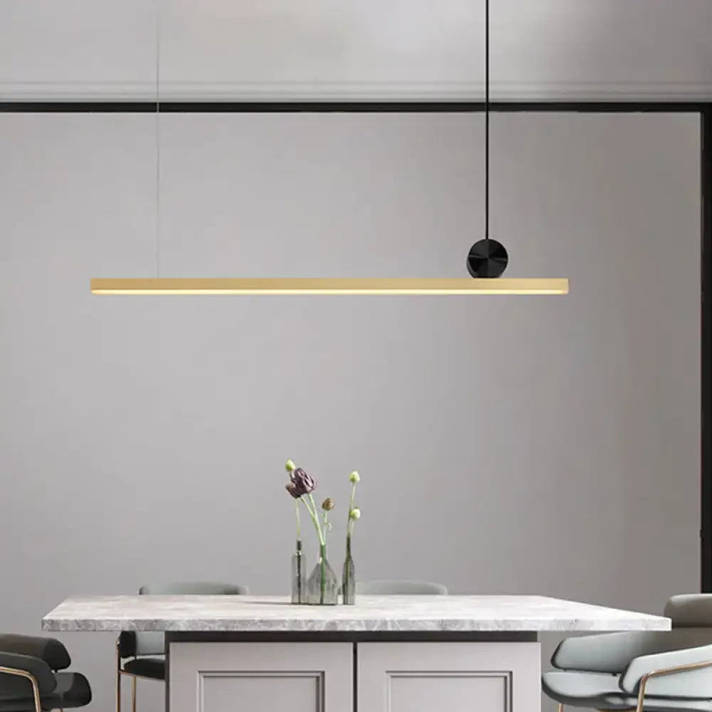 Modern minimalist black and gold linear led ceiling light with a gold finish and sleek black circular fixture for kitchen island
