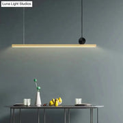 Minimalist black and gold finish linear led ceiling light with sleek modern design for kitchen island illumination