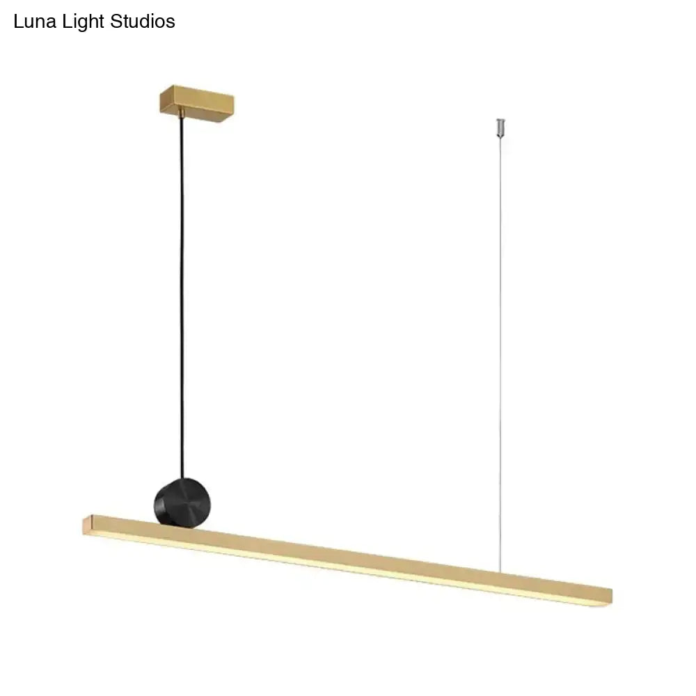 Minimalist black and gold finish ceiling light with sleek rectangular bar and dual cords for kitchen island lighting