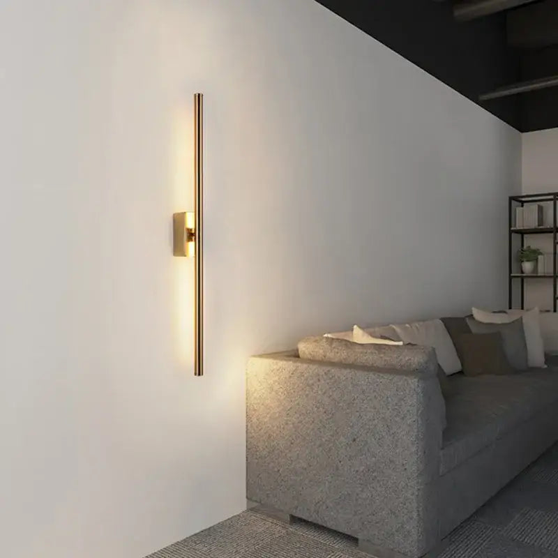 Minimalist black nordic led wall sconce with gold-toned sleek vertical bar design for modern living room decorbites decor