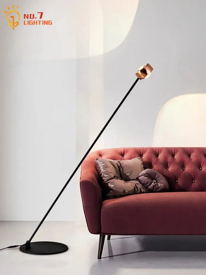 A minimalist black induction dimming floor lamp with slender pole and copper spherical head for living room decorbites induction dimming