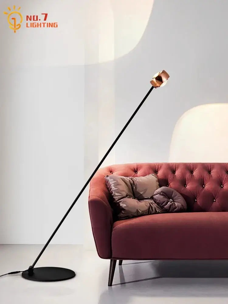 A minimalist black induction dimming floor lamp with slender pole and copper spherical head for living room decorbites induction dimming