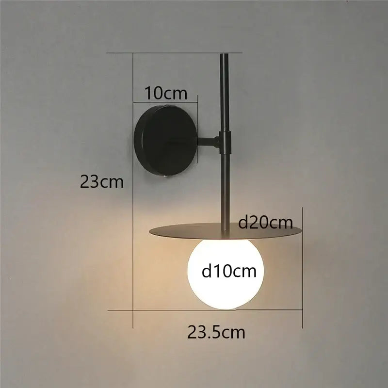 Minimalist black iron glass led wall light with circular base and warm glow for bedroom and living room decorbites iron glass