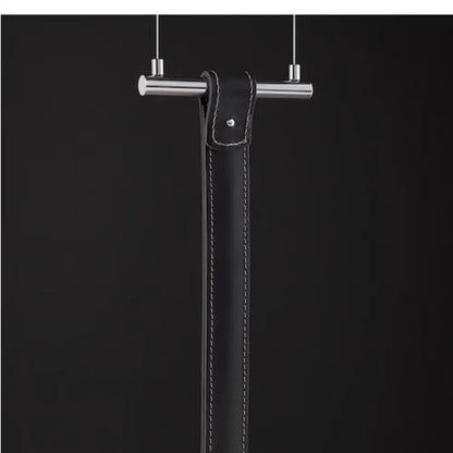 Minimalist black leather belt pendant light with white stitching and silver-toned metal bar for decorbites art minimalist decor