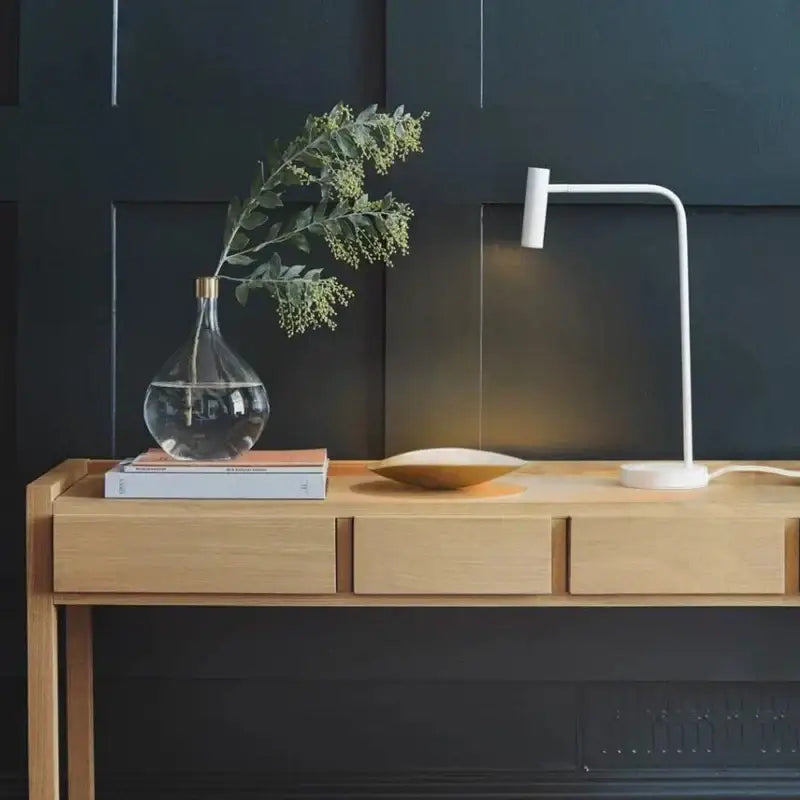 White minimalist desk lamp with slender curved arm and cylindrical head for enna led dimmable floor lamp living room