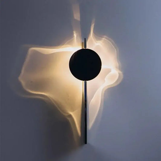 Minimalist black led wall sconce with sleek circular design and warm ambient light for living room decorbites led wall lighting