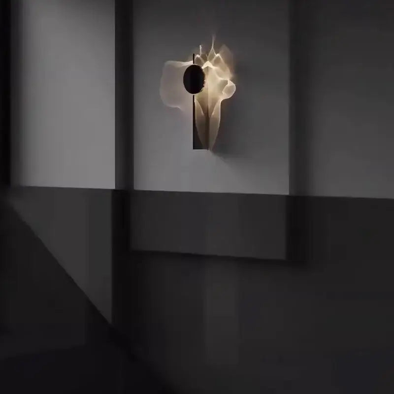 A minimalist black led wall sconce with a sculptural translucent white body and dark circular accent for living room decorbites led wall