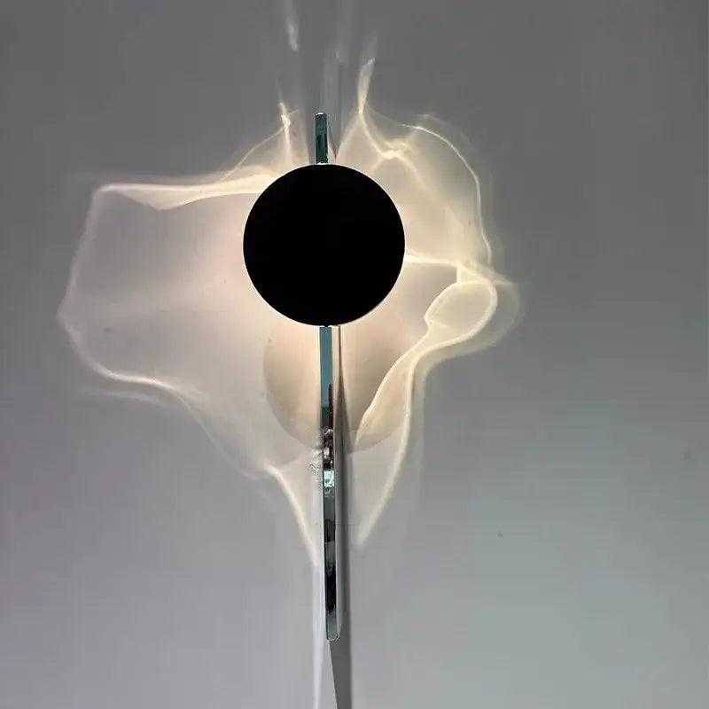 Minimalist black led wall sconce with chrome finish and central black accent casting soft ambient light for living room decorbites led wall