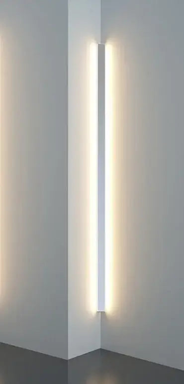 Minimalist black linear led wall lamp with a slim white frame emitting warm light for bedroom and living room use