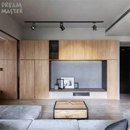Modern minimalist wooden media cabinet with sleek black frame and integrated lighting paired with black matte gu10 5w led ceiling light