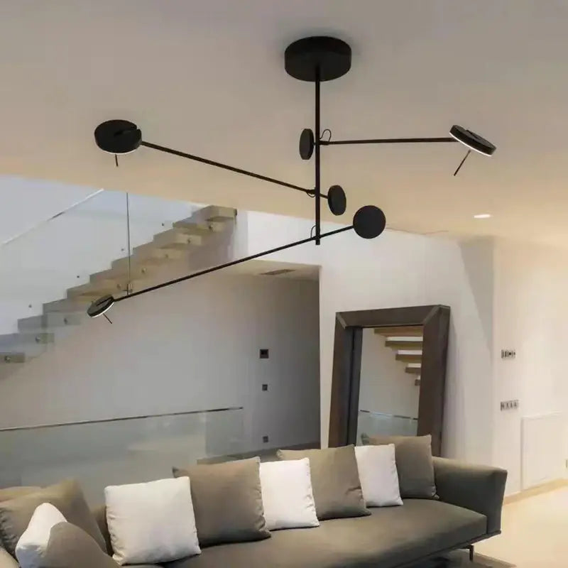 Minimalist black metal pendant light with circular led fixtures and slender arms for living room decorbites black metal