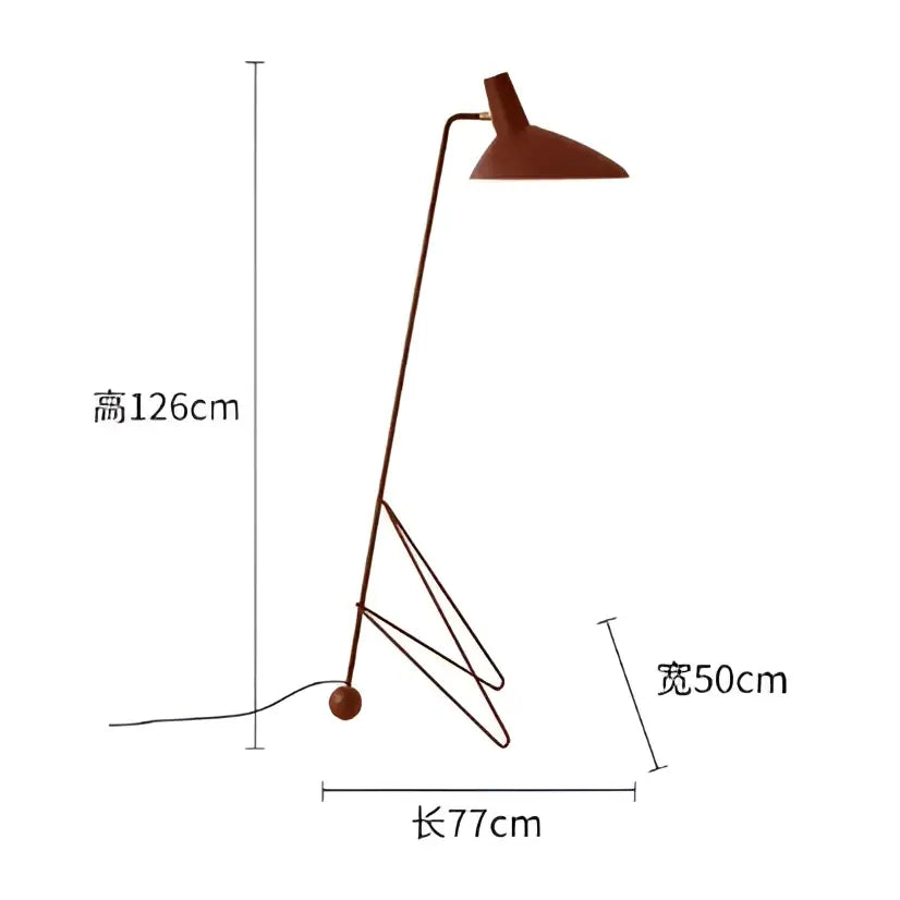 A sleek minimalist rust-colored metal tripod desk lamp with angular design for bedroom or office use