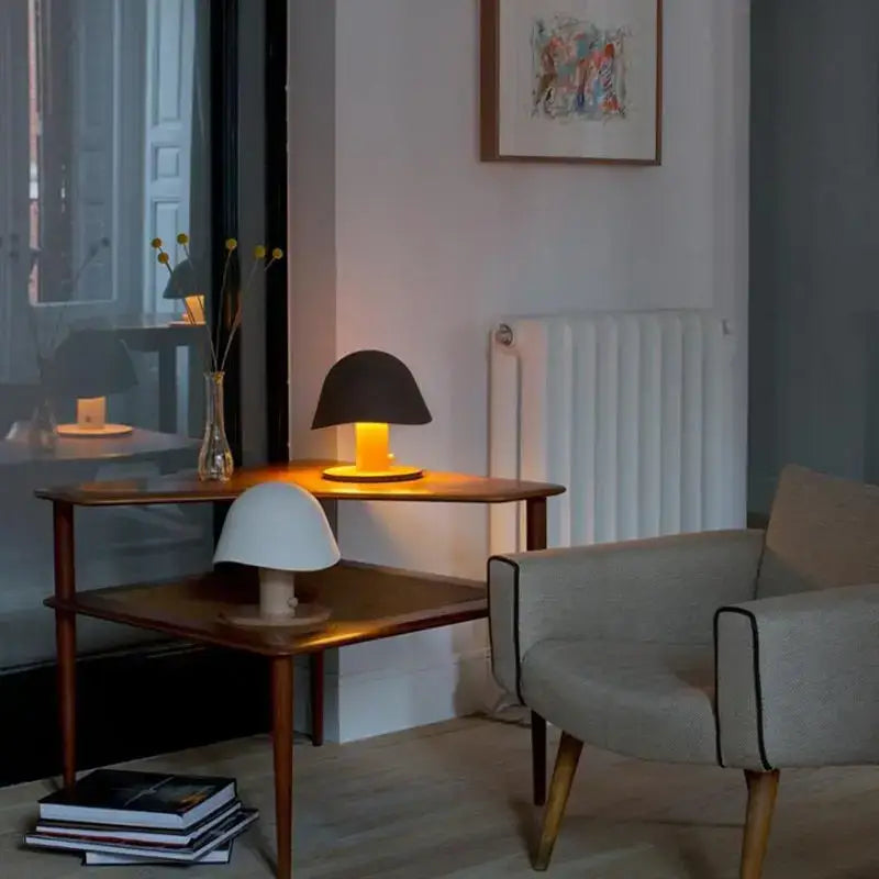 Minimalist black mushroom glass table lamp with matte shade and warm amber glow for bedroom decorbites glass table lamp