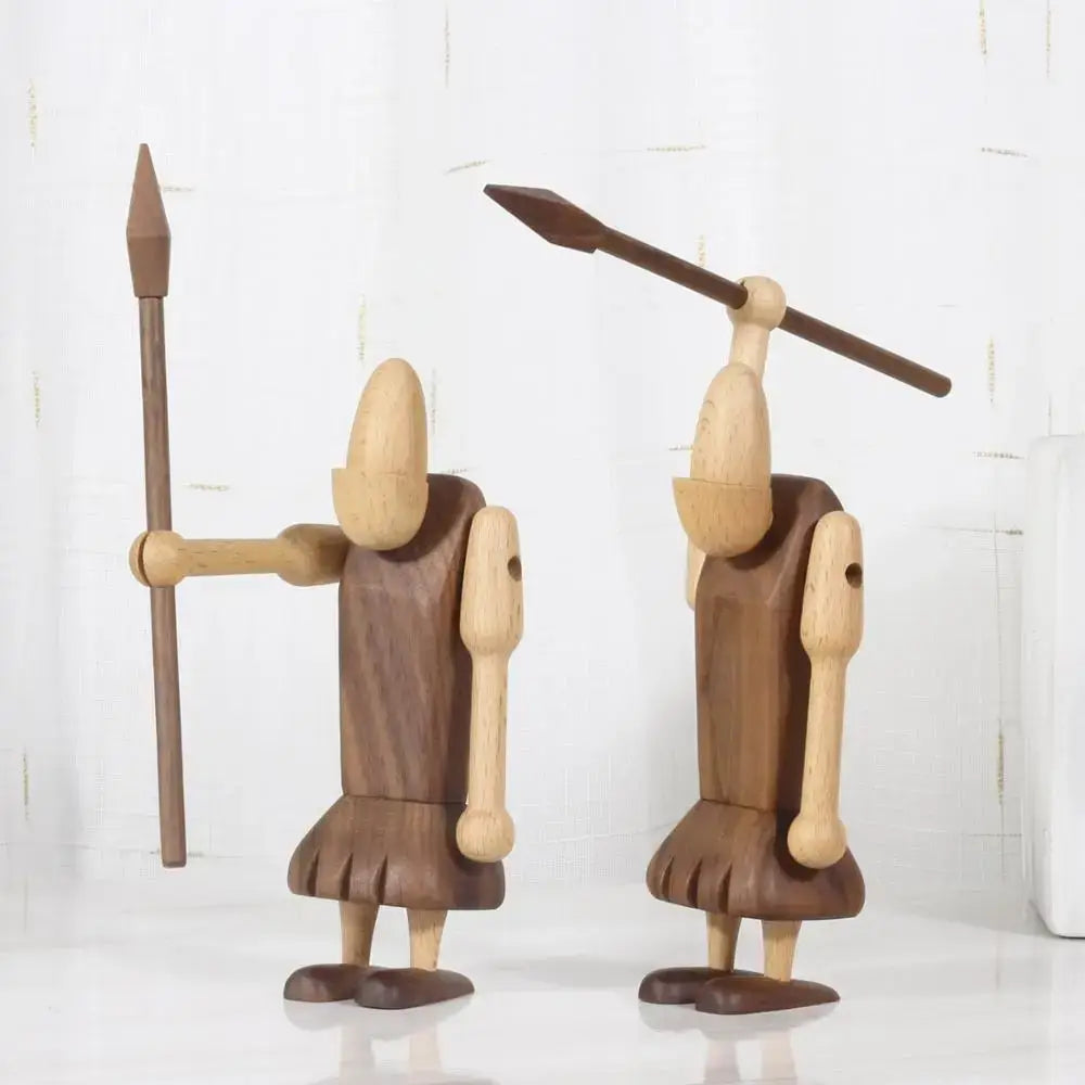Two minimalist black and natural wood carving figurines handcrafted as wood carving warrior decor for living room
