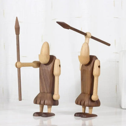 Two minimalist black and natural wood carving figurines handcrafted as wood carving warrior decor for living room