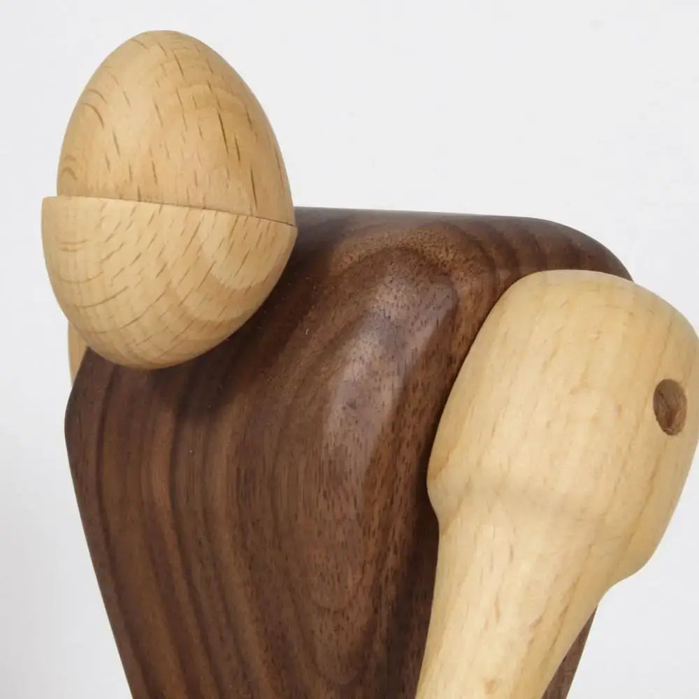 Handcrafted minimalist black and natural wood carving figurines featuring dark walnut and light wood acorn design