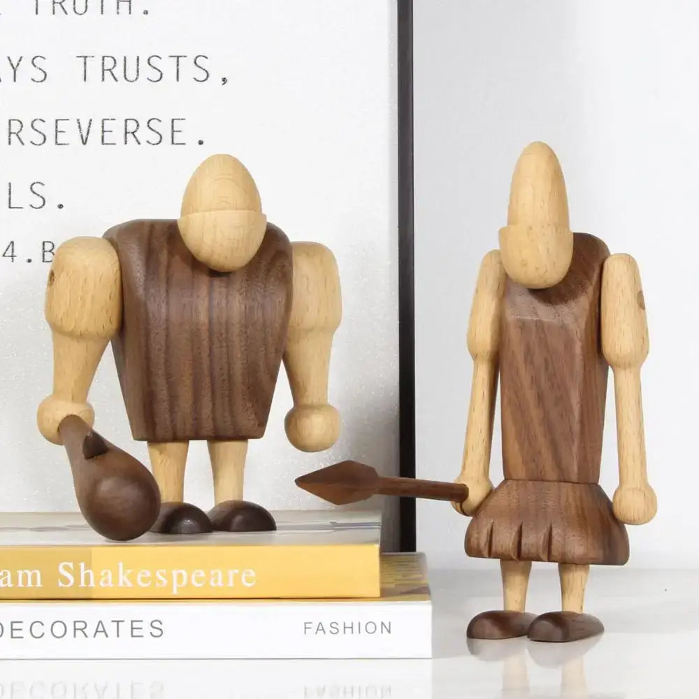 Minimalist black and natural wood carving figurines with smooth light limbs and dark torso for living room decor