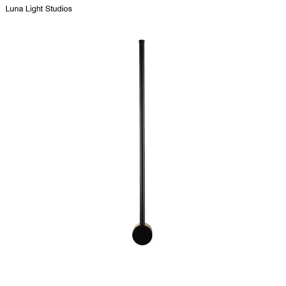 Black matte metal floor lamp with cylindrical shaft and circular base for 110v-120v wall light bulb base use