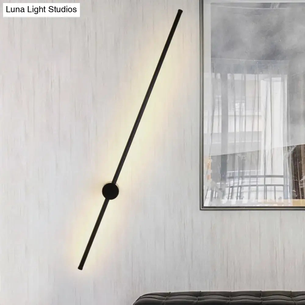 Minimalist black needle wall light with sleek rod and circular base wall sconce for 110v-120v or 220v-240v bulb base