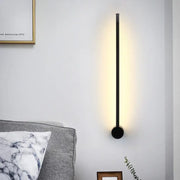 Minimalist black needle wall light with sleek cylindrical design and warm ambient lighting for 110v-120v wall light bulb base