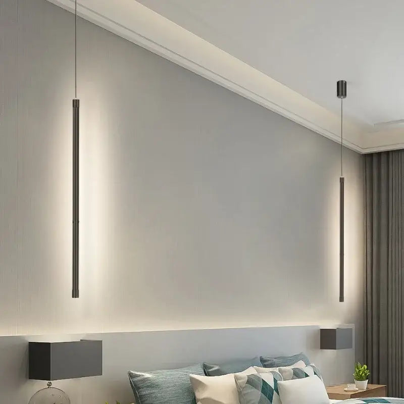 Two sleek black nordic led tube pendant lights hang from ceiling in kitchen and dining room decorbites black nordic design