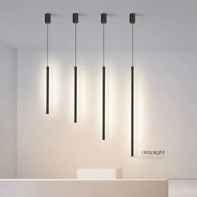 Four sleek black nordic led cylindrical pendant lights with minimalist design for kitchen and dining room decorbites black nordic