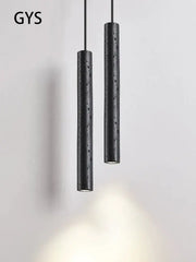 Minimalist black stone tube led pendant light with textured concrete finish for bedroom lighting decorbites black stone