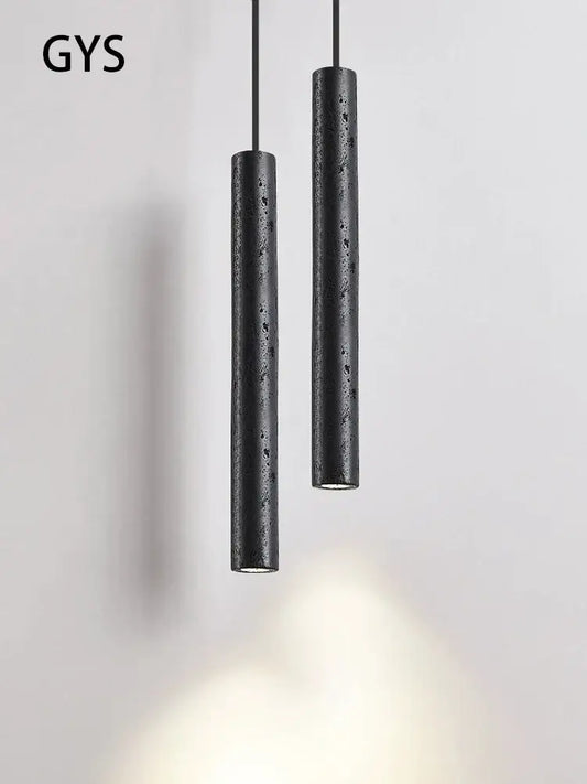 Minimalist black stone tube led pendant light with textured concrete finish for bedroom lighting decorbites black stone