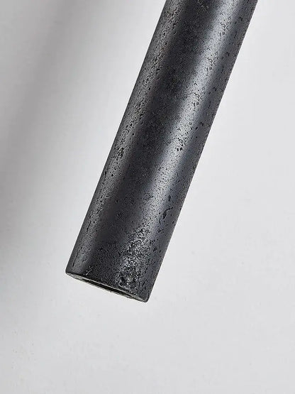 Minimalist black stone tube led pendant light with matte textured finish for bedroom lighting by decorbites black stone
