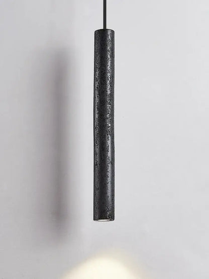 Minimalist black stone tube led pendant light with textured matte finish ideal for bedroom lighting decorbites black stone