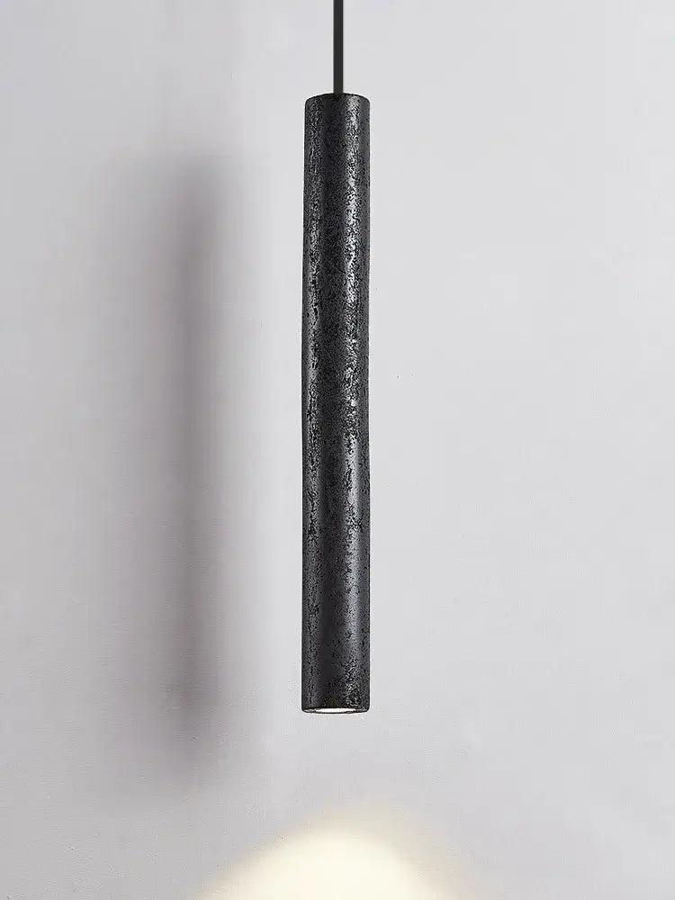 Minimalist black stone tube led pendant light with textured matte finish ideal for bedroom lighting decorbites black stone