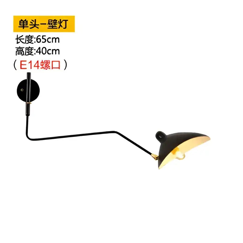 Minimalist black and gold wall lamp with a sleek articulated arm, perfect for bedroom decorbites dawn spider serge lighting