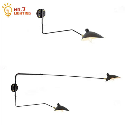 Minimalist black metal wall lamp with two adjustable arms designed for bedroom decorbites dawn spider serge lighting