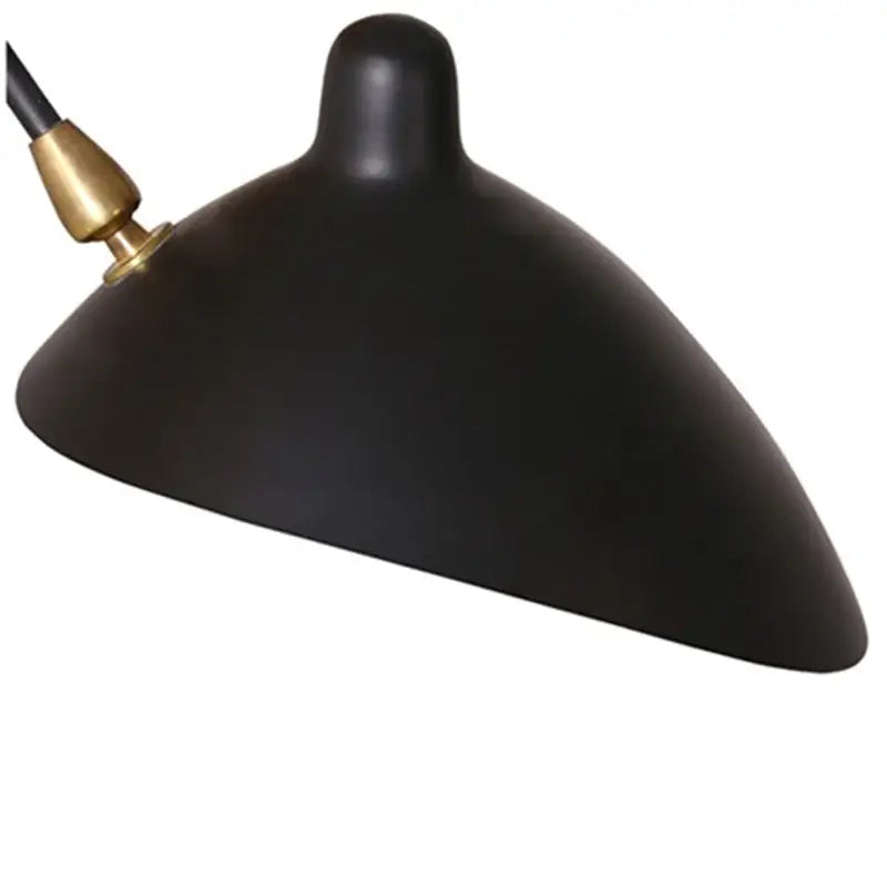Minimalist black wall lamp with adjustable two arm light featuring a black matte lampshade and brass accent decorbites black serge
