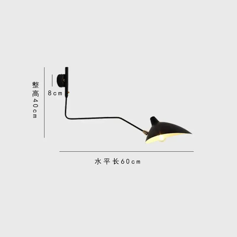 Minimalist black serge mouille wall lamp with matte finish curved arm and conical shade for adjustable living room lighting