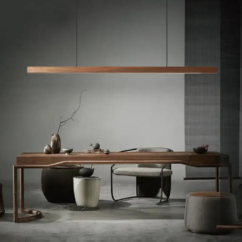 Minimalist black walnut log pendant light with sleek wooden table featuring smooth finish and curved legs for dining room decorbites black walnut