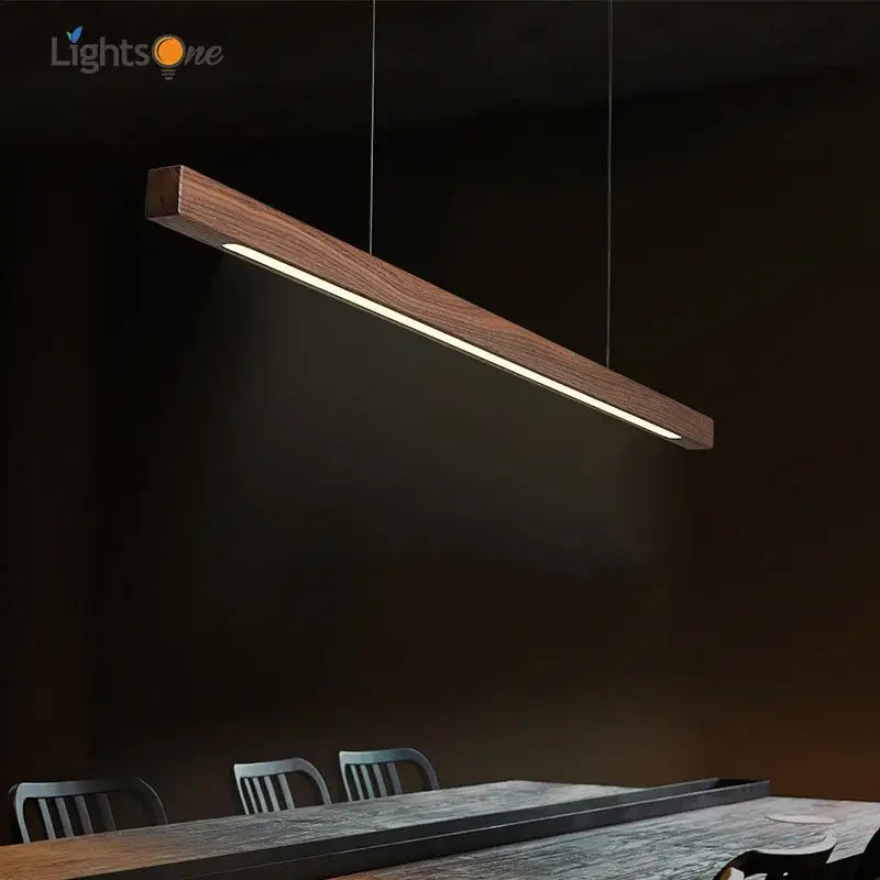 Minimalist black walnut log pendant light with a warm glow and sleek rectangular design for dining room decorbites