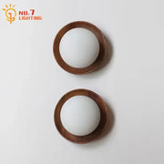 Pair of minimalist decorbites black walnut wall lamp with warm wooden rings and frosted glass globes for bedroom and living room